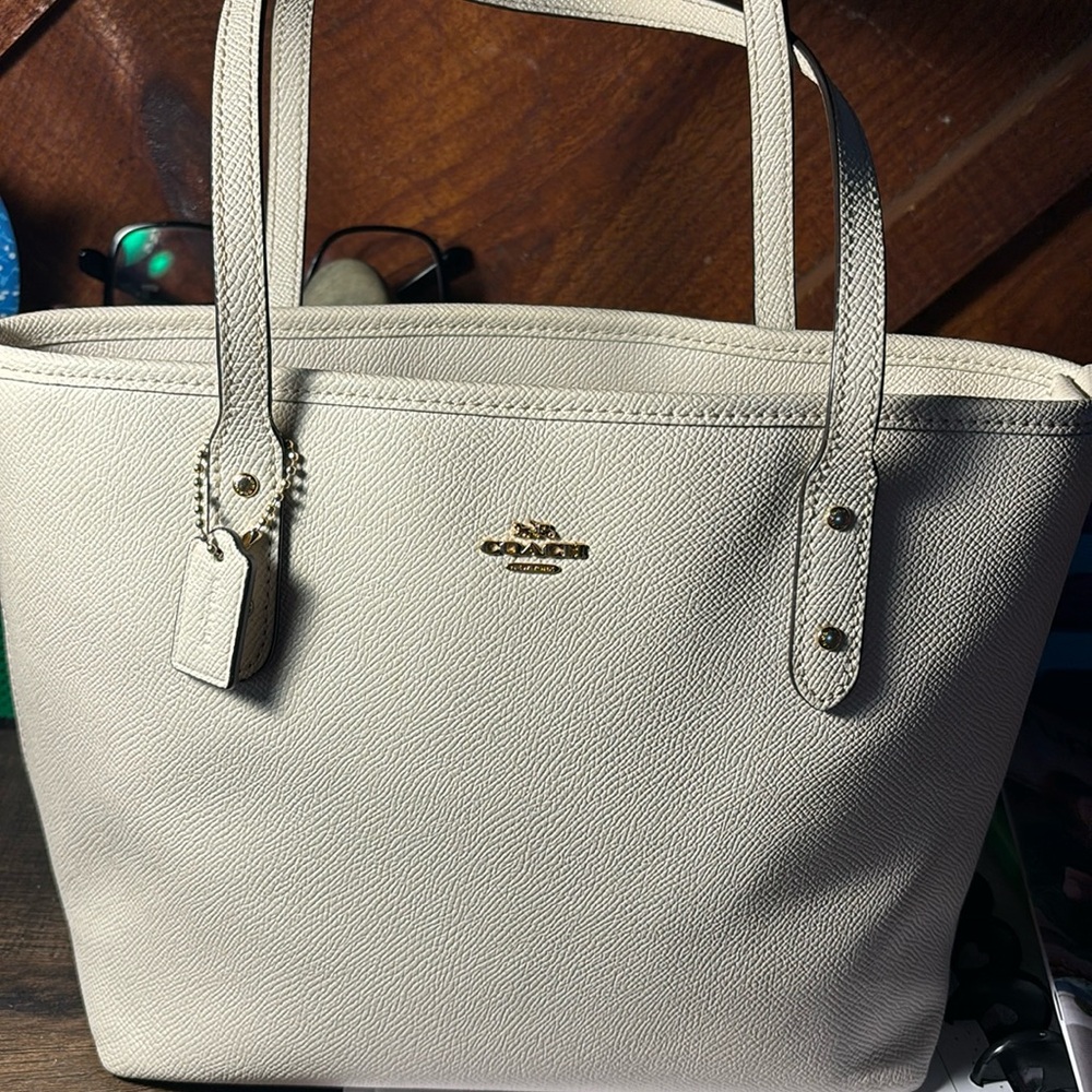 Like new, has a small scratch on the bottom shown on one of the pics.